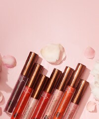 lipsticks on peach background