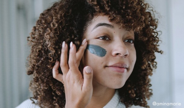woman with hands on her face